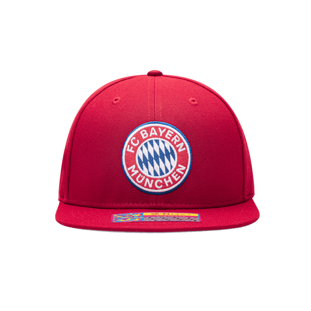 Front view of the Bayern Munich Dawn Snapback with high crown, flat peak brim, adjustable closure, in red