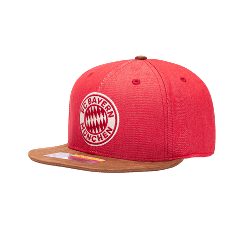 Side view of the Bayern Munich Orion Snapback with high structured crown, flat peak suede-like brim, and snapback closure, in Red/Brown.