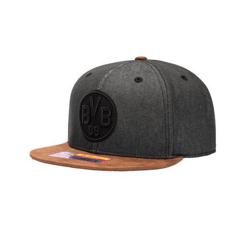 Side view of the Borussia Dortmund Orion Snapback with high structured crown, flat peak suede-like brim, and snapback closure, in Black/Brown.