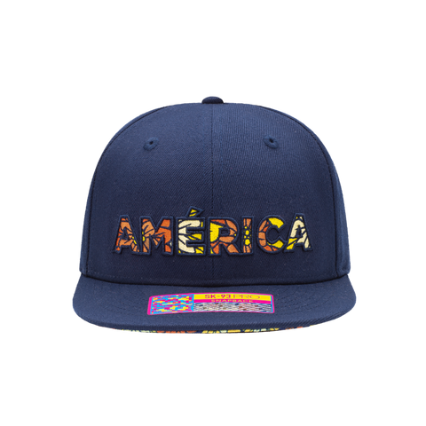 Club America Day of the Dead Snapback Hat with America script with marigold floral overlay embroidered on the front, Club America logo embroidered on the side, "Dia de Muertos" embroidered on the back, and marigold floral print on the under peak. The hat has a high crown, flat peak brim, and a snapback closure.