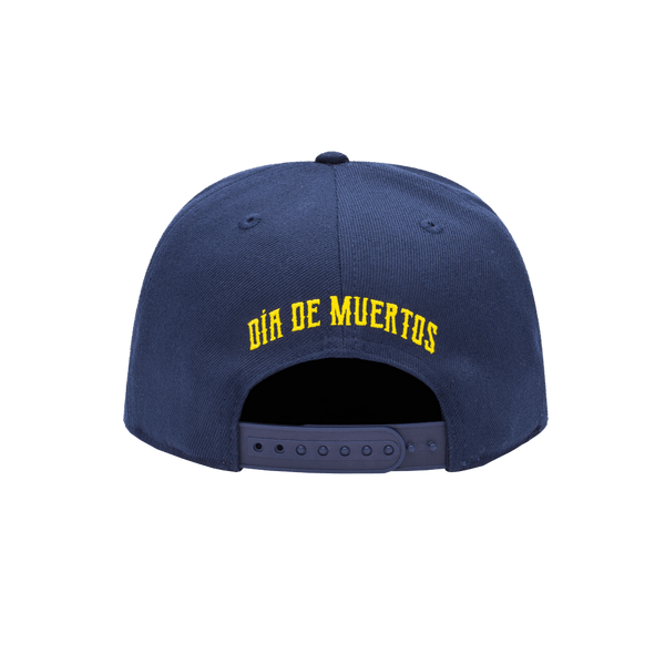 Club America Day of the Dead Snapback Hat with floral skull embroidered on the front, Club America embroidered on the side, "Dia de Muertos" embroidered on the back. The hat has a high crown, flat peak brim, and a snapback closure.