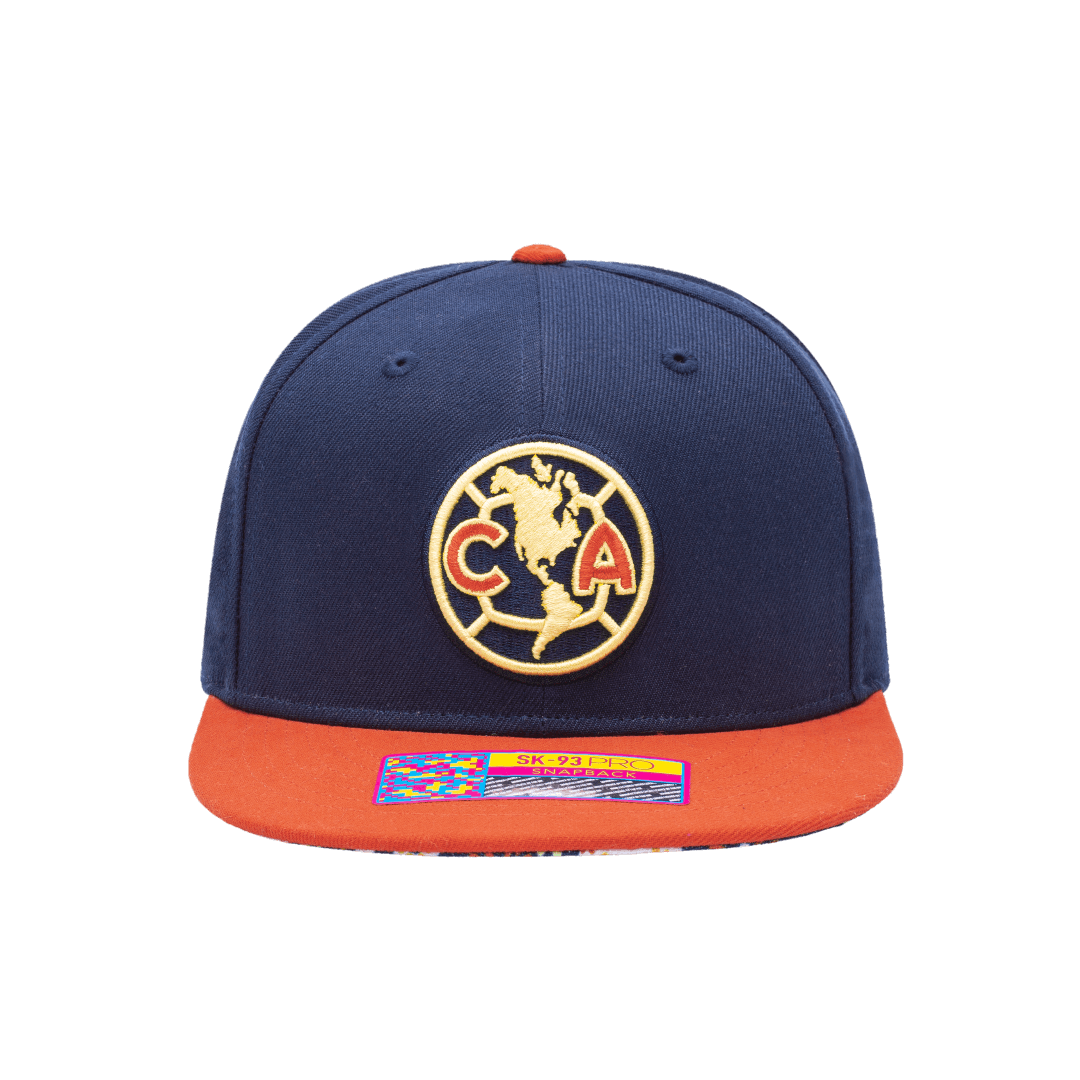 Club America Day of the Dead Snapback Hat with Club America logo embroidered on the front, floral skull embroidered on the side, "Dia de Muertos" embroidered on the back, and marigold and calavera print on the under peak. The hat has a high crown, flat peak brim, and a snapback closure.