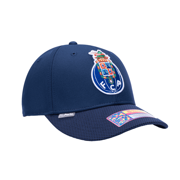 Side view of the FC Porto Trigger Adjustable hat with mid constructured crown, curved peak brim, and slider buckle closure, in Navy.