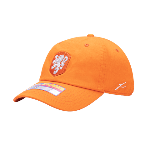 Side view of the Netherlands Bambo Classic hat with low unstructured crown, curved peak brim, and buckle closure, in orange.