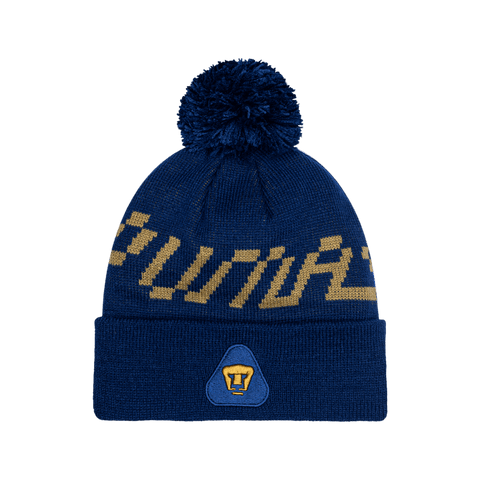 Pumas Pixel Beanie with embroidered club logo on ribbed ruff, club name knitted in hat body, and pom detailing, in Navy.